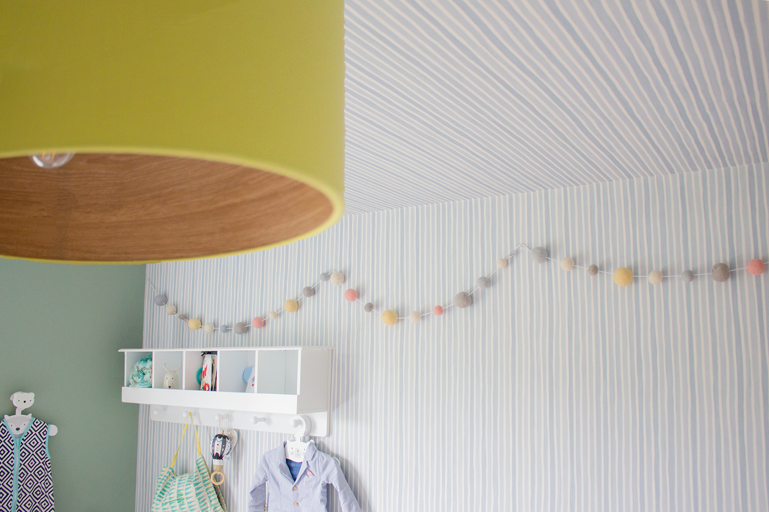 A photo of the subtly stripe wallpaper on the ceiling