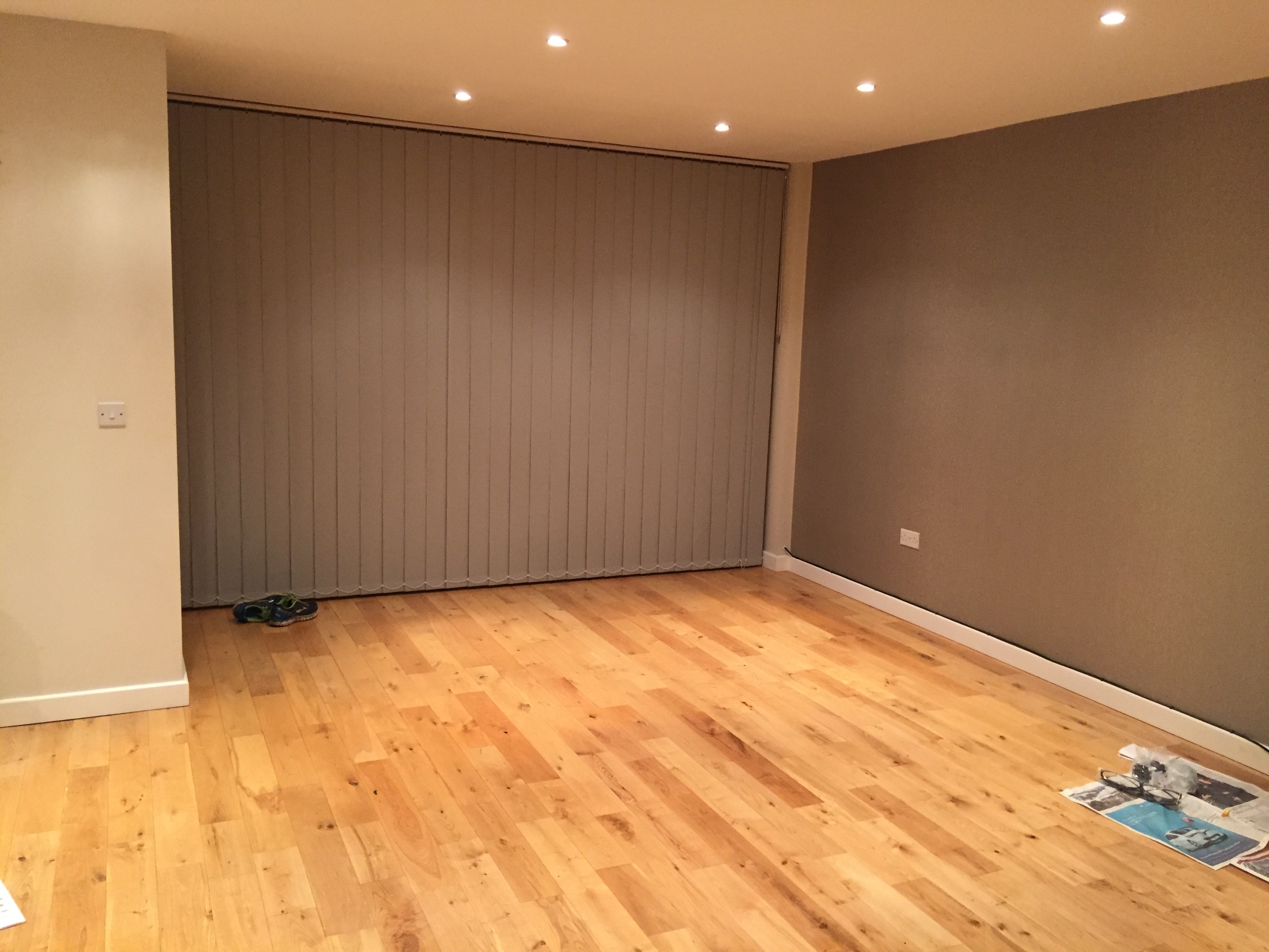 A photo of the client's living room which is fairly bare and uninviting