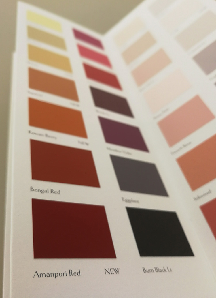 A picture of the page in the Sanderson colour card containing Amanpuri Red.