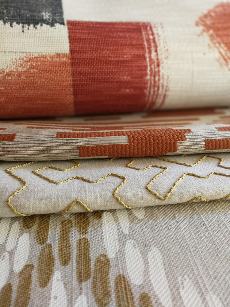 a photo of some fabrics in Autumnal colours from the Villa Nova collection called Huari