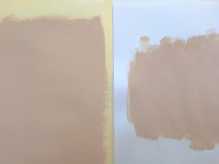 pink paint on lining paper next to the same pink paint of white paper