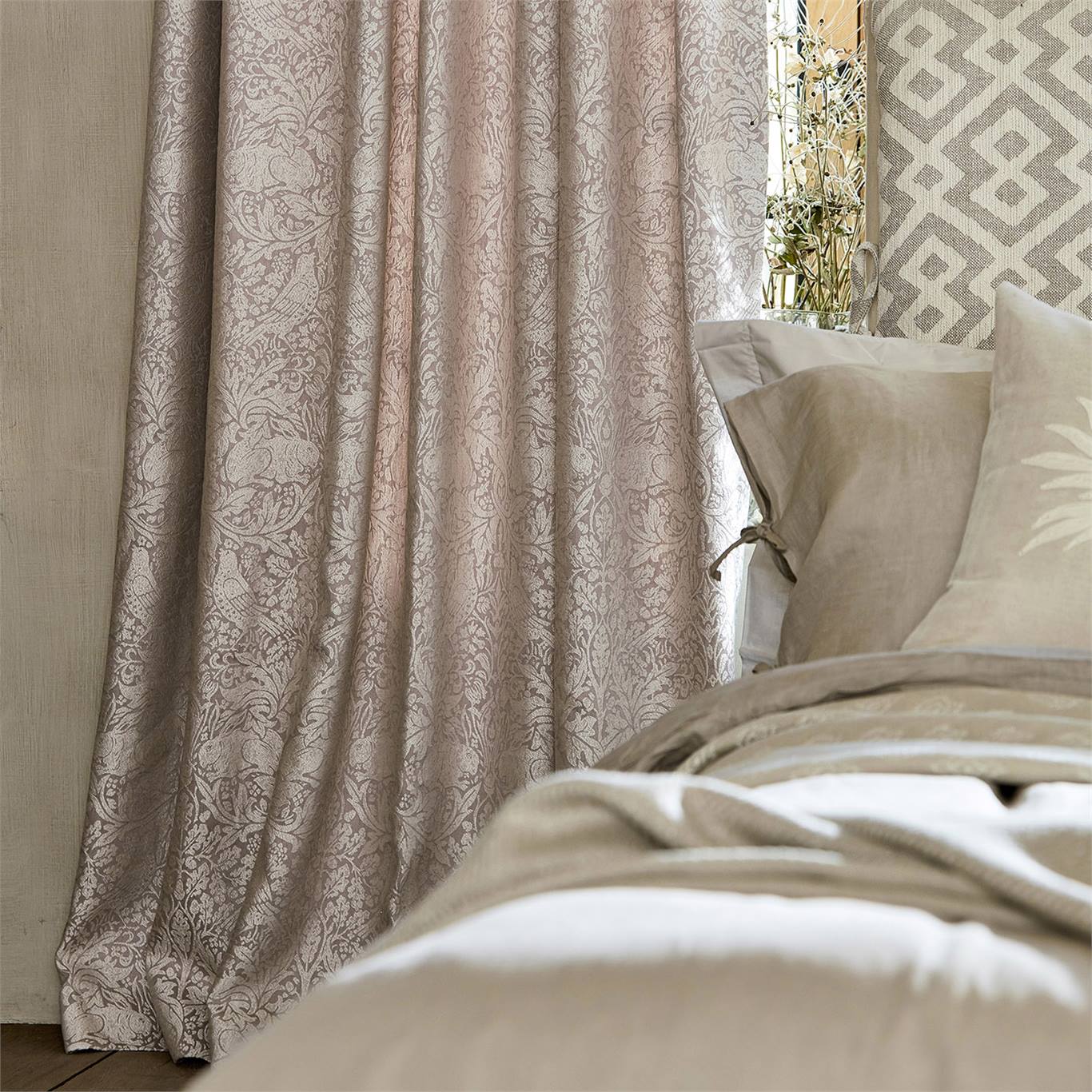 'Pure Brer Rabbit' in soft pink, as curtains behind a bed